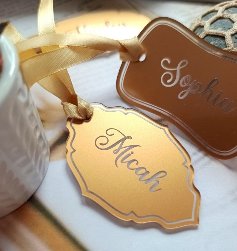 A personalized acrylic name cutout is ideal for wedding tag